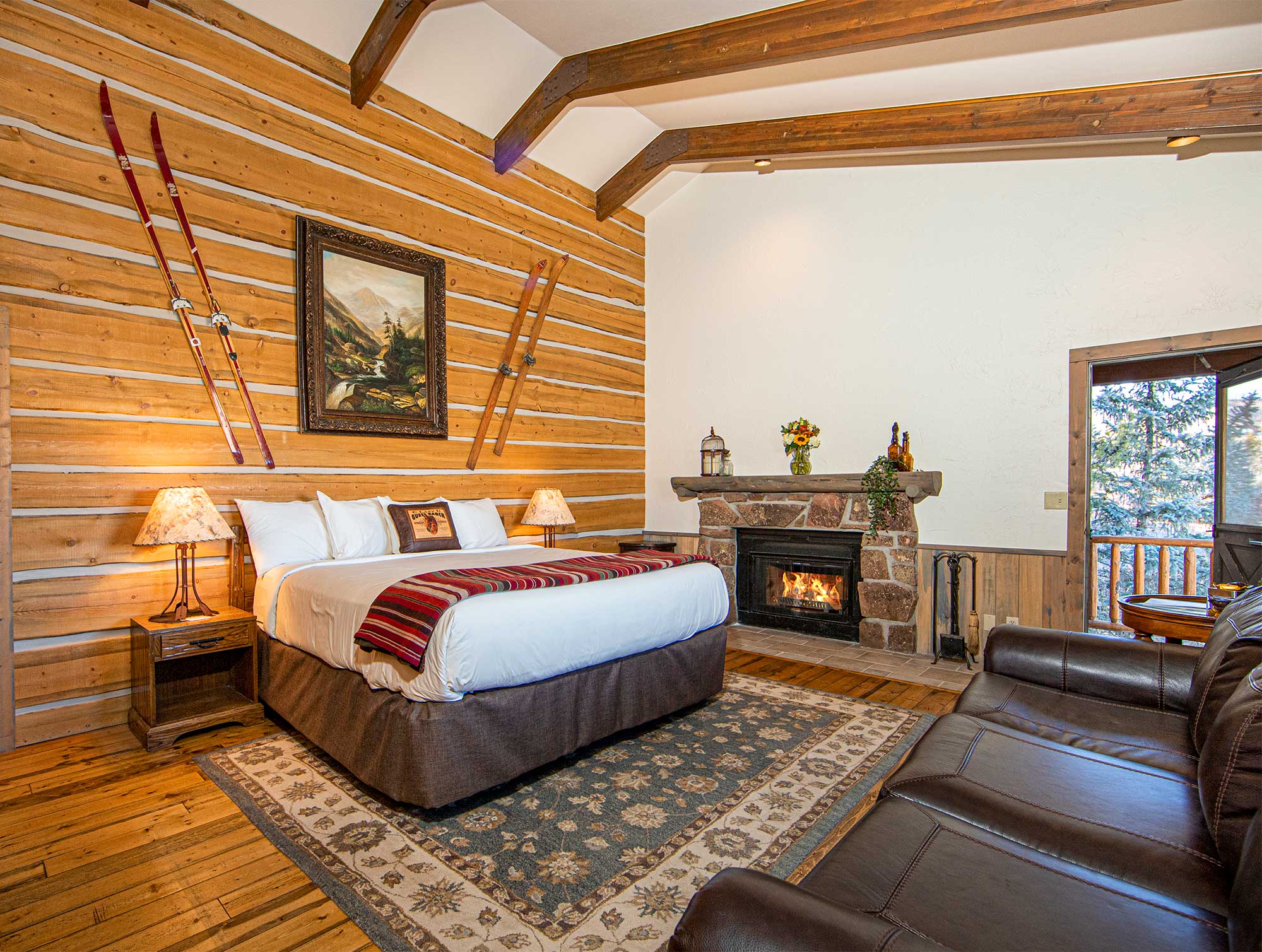 A cabin with king size bed and fireplace